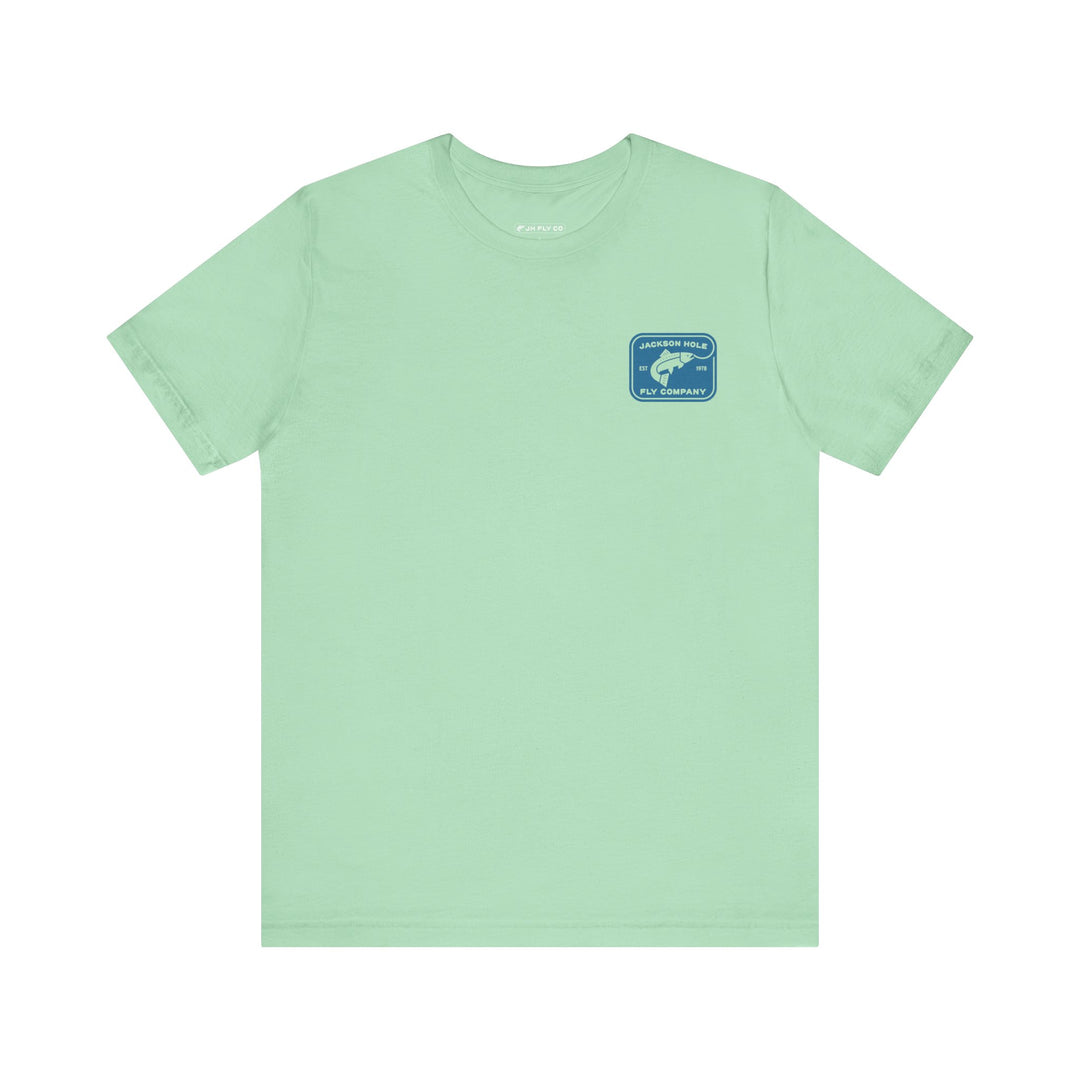 JHFLYCO Teton Brown Trout Badge Tee - Hackle Blue Logo