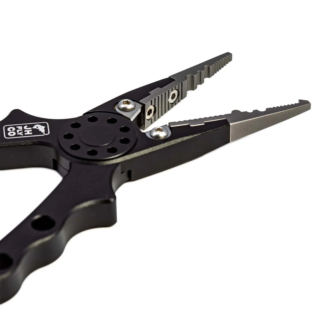 JHFLYCO Aluminum Fishing Pliers with tungsten carbide cutters, split-ring jaw, and black CNC-machined handles | Jackson Hole Fly Company