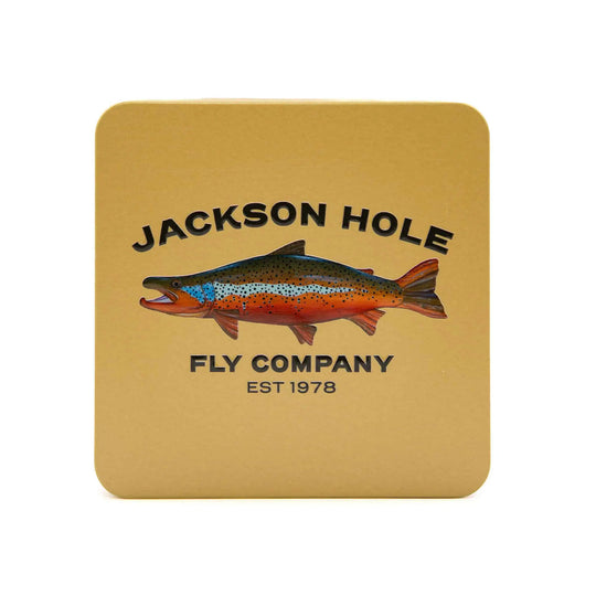 JHFLYCO Slim Metal Fly Box with brown trout artwork by Piper Nunn, Jackson Hole Fly Company lettering, and a golden background